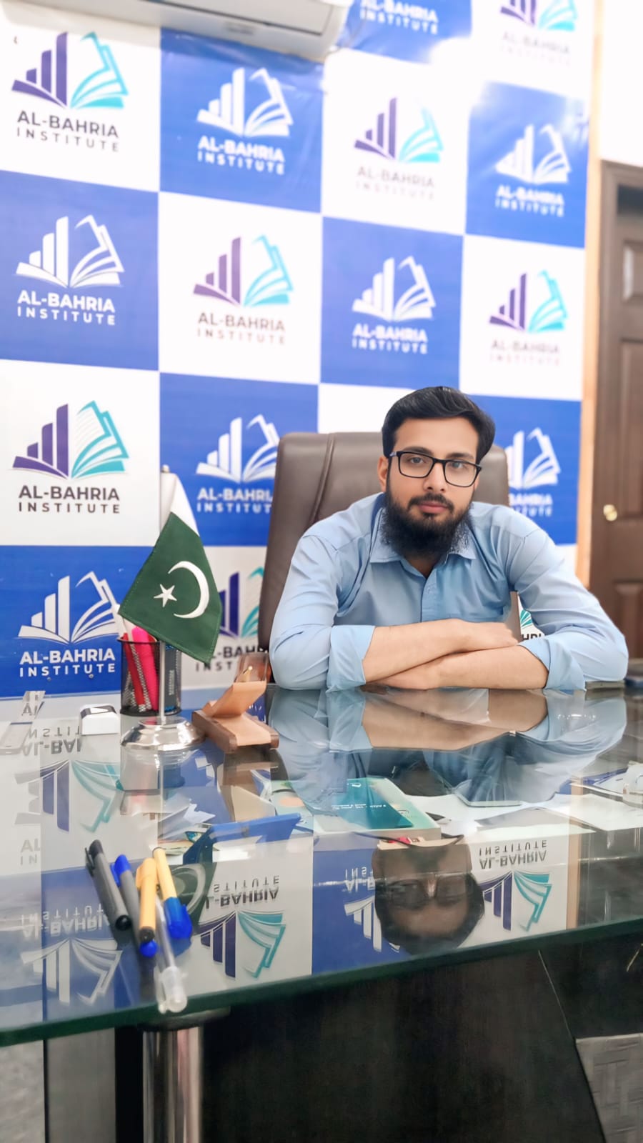 Dr. Husnain Muavia, Clinical Coordinator and Operations Manager at Agha Institute of Health Sciences, seated in his office in Lahore